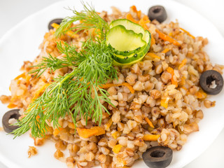 pilaf with meat on a white plate