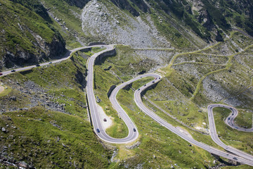 View of the mountain road Transfagarashan, also known as Ceaushescu's Folly which cross the Fagarash ridge in the Carpathian Mountains in Romania. The most beautiful mountain road in Europe. 