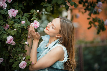 Naklejka premium Fresh summer card, beautiful woman with roses, outdoor