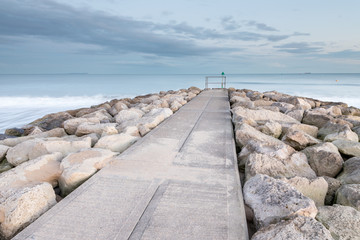 Road to nowhere with a barrier at the end