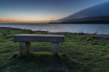 stone bench seat looking out to sea