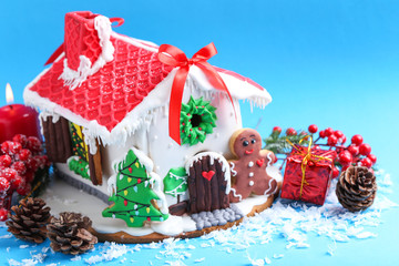 Christmas gingerbread house on blue background