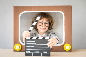 Child playing with cartoon TV