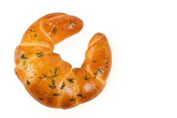 Freshly baked large  croissant, sprinkled with dill. Isolated on white background.