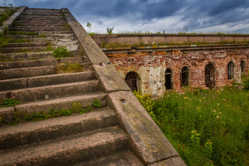 Stone staircase. Ancient stairs. Abandoned buildings. Kronstadt. Fort in the Gulf of Finland.