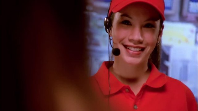 Smiling female fast food worker.