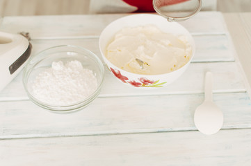 Young girl making cream for cupcakes.