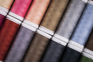 Sewing instruments, threads, needles, bobbins and materials.