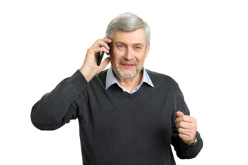 Concentrated senior man with phone. Mature man in office wear talking on smartphone and thinking. Elderly pensive man with mobile phone on white background.