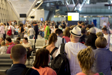 Closeup Queue of Europen people waiting at boarding gate at airport