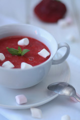 Strawberry soup in a white cup