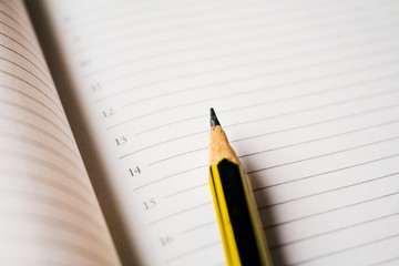 Pencil on a sheet of notepad