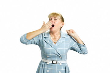 Yawning woman on white background. Beautiful stretching and yawning white-skin woman isolated on white background.