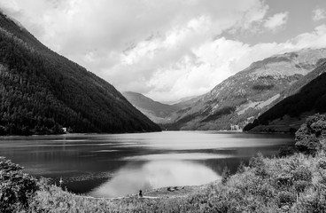 Black and white landscape with lake in the background