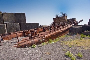 Rusty abandoned shipwreck on the beach in Sukhum, Abkhazia