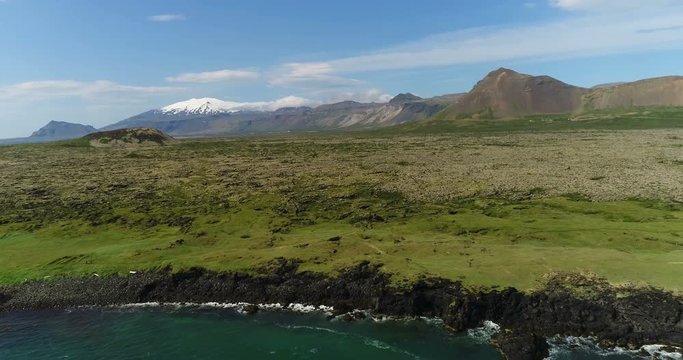 Aerial drone footage of Iceland landscape - West Iceland nature coast and famous snaefellsjokull volcano mountain on Snaefellsnes peninsula.