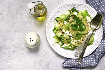 Cucumber salad with quinoa and feta cheese.Top view.