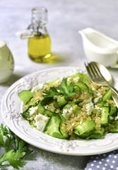 Cucumber salad with quinoa and feta cheese.