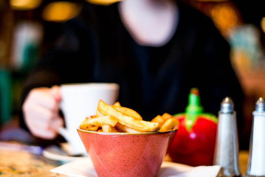 Bowl of Chips or French Fries With Tomato Sauce