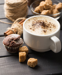 hot black coffee with cookies and beans in cafe