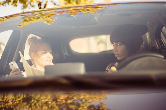 Co-workers Carpooling To Work During Morning Commute