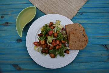 Fresh vegetable salad, healthy food, tomatoes and salad leaves. Healthy chicken salad with fresh vegetables