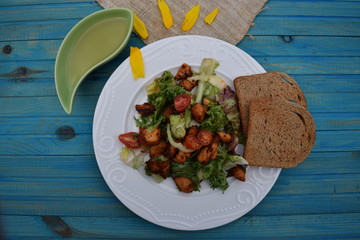 Fresh vegetable salad, healthy food, tomatoes and salad leaves. Healthy chicken salad with fresh vegetables