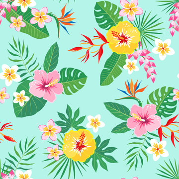 Bright tropical seamless pattern with hibiscus, frangipani, heliconia and bird of paradise flowers on aquamarine background.