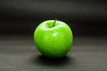 Single green apple