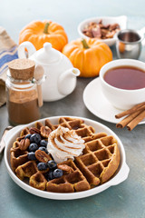 Pumpkin waffles with whipped cream and cinnamon