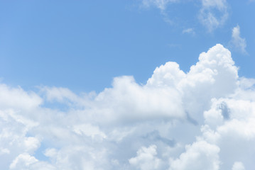 Naklejka na ściany i meble Blue sky with soft white clouds