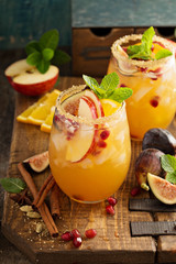Fall sangria cocktail with apple, figs and orange