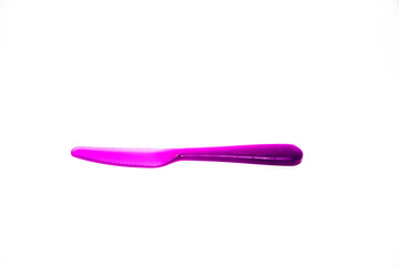Plastics knife purple of child isolated on white background