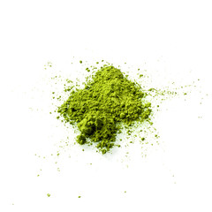 Matcha green tea powder on white background flat view. Matcha is made of finely ground green tea...
