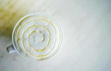 Obraz na płótnie Canvas Honey milk with milk foam topping hot drink