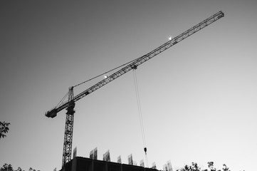 Tower crane against the sky, jib crane, view from below