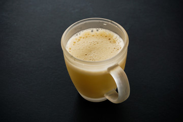 Tea with in a mug or popularly known as Teh Tarik isolated in white view from top.