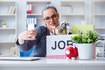 Businesswoman taking selfie on last day in office