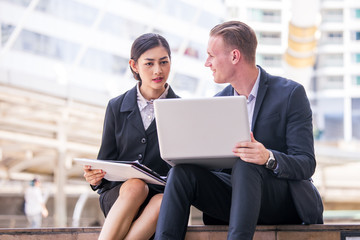 Businessman sitting and use Laptop for Present Work Project. People working concept.