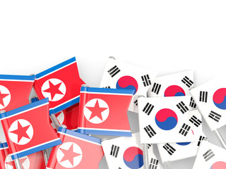 Flag pins of North Korea (DPRK) and South Korea  isolated on white