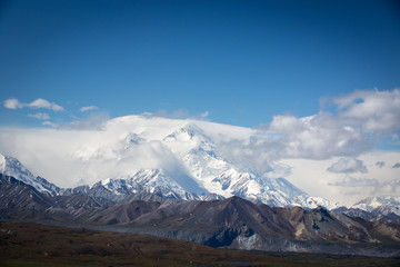 Fototapeta na wymiar Snowcapped and foggy cloudy Mt. McKinley, Denali National Park, Alaska.