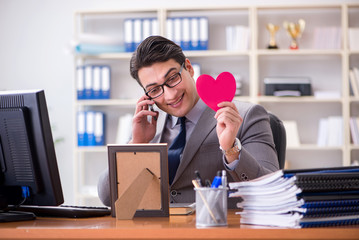 Businessman feeling love and loved in the office