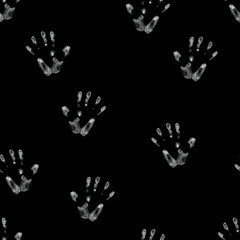 seamless hand drawn pattern of palm imprints drawn in white chalk isolated on black background