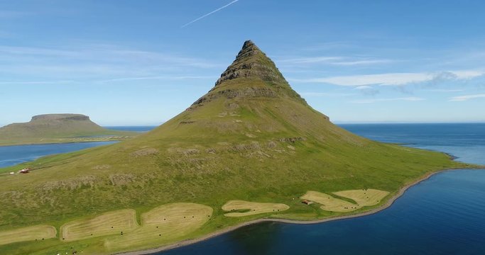 Aerial drone video of Iceland nature Kirkjufell mountain landscape on West Iceland on the Snaefellsnes peninsula. Iceland tourist destination and most photographed Icelandic mountain and famous icon.