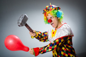Funny clown in comical concept