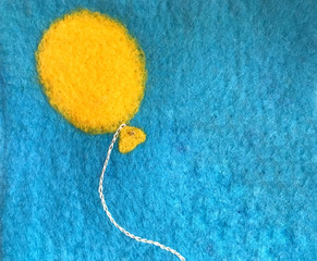 Own handmade greetings card made of felt. Big balloon flying in sky with empty space for text. © MigrenArt