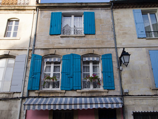 Fototapeta na wymiar Old row houses with shutters, Arles, France