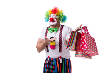 Funny clown after shopping bags isolated on white background