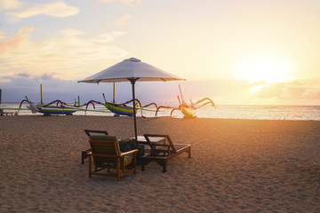Stunning beautiful sunlight beach with relaxing scenery on a beach. Famous travel destination in Sanur, Bali, Indonesia.