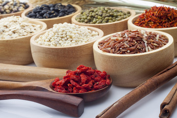 Cereal grains , seeds, beans on wooden background
